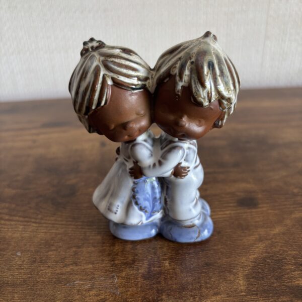 Kitsch Boy and Girl Figures Hugging -see description